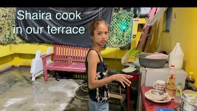 'Our terrace in home, Shaira cooking Filipino food.'