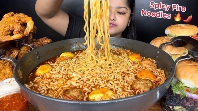 'SPICY SOUPY FIRE NOODLES WITH FRIED EGGS AND FRIED MOMO