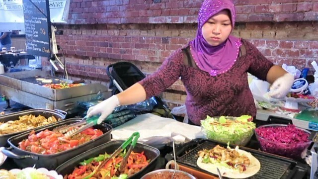 'London Street Food from Lebanon. The Halloumi Cheese and Chicken Wrap. Seen in Brick Lane'