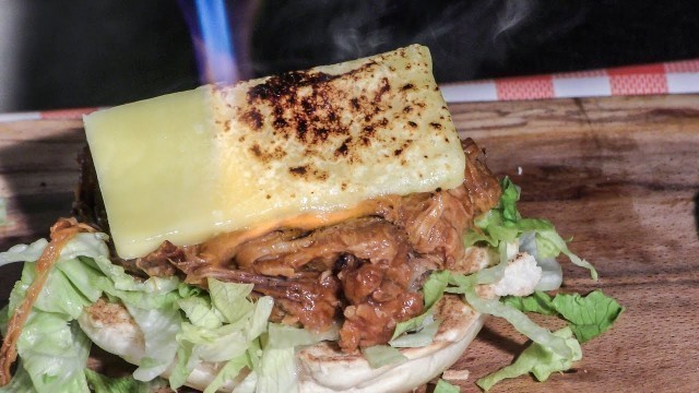 'Bagels with Pulled Meat and Flamed Melted Cheese. Street Food of London, Brick Lane'