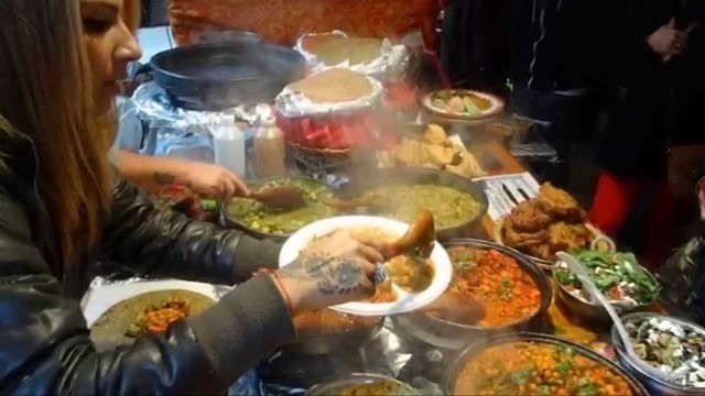 'Indian / Turkish Fusion Street Food wraps at Roti Roll stall in Sunday UpMarket, Brick Lane, London.'