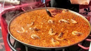 'London Street Food. Preparing a Fresh Spanish Giant Paella with Seafood. Seen in Brick Lane'