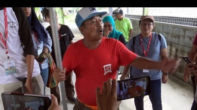 'Man with a red T-Shirt - Crocodile Feeding'