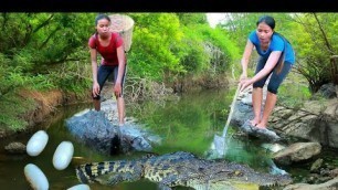 'two woman Cooking crocodile egg for food Eating delicious - Lifestyle cooking'