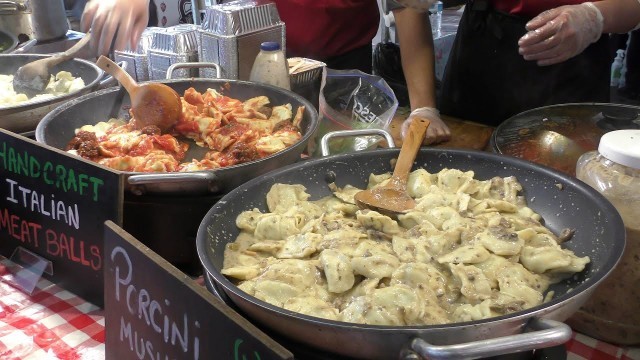 'London Street Food. Italian Pasta, Meatballs, Mushrooms Tomato and Pesto Sauces Seen in Brick Lane'